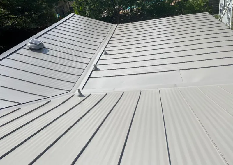 Solar attic fan installed on a metal roof for Roof Ventilation in Hainesport